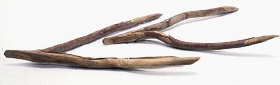 Wooden loom frame. Consists of two branch “feet” on which a crossbar is attached, and a board with wide holes in which the two branch feet are inserted, and a weaving sword. Collected by Georg Söderbom in Charchak at Kum-darya during the Hedin expedition in May 1934 (Museum of Ethnography, Stockholm)