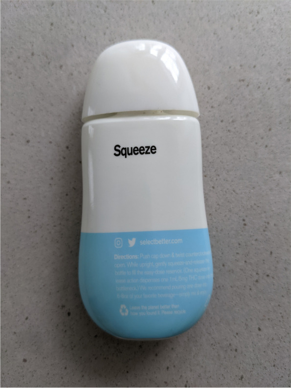 This image displays the back view of the select squeeze bottle and backward-facing product label including the select website, social media information, product instructions, and recycling insignia