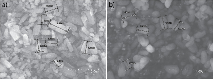 SEM images of a polycrystalline sample of 3 at two different magnifications (a and b) with selected sizes marked.