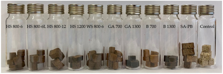 Weighed board specimens in closed vials.
