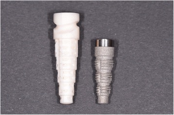 On the left, the Tübingen ceramic implant; on the right, the Frialit stepped-screw implant. The transgingival part with the cervical groove of the Tübingen implant has been removed in the Frialit implant; this part is now replaced by a mirror-polished transgingival portion of the Frialit abutment; all the intraosseous portion of the implant has now a thread and is shaped like the original Tübingen implant