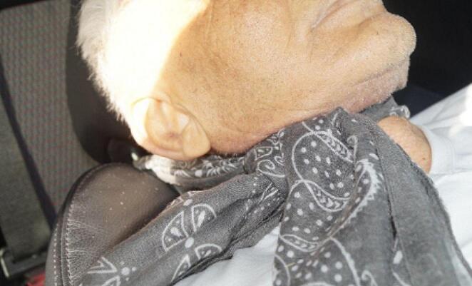 The pashmina scarf wrapped around the neck and the headrest at the driver’s seat