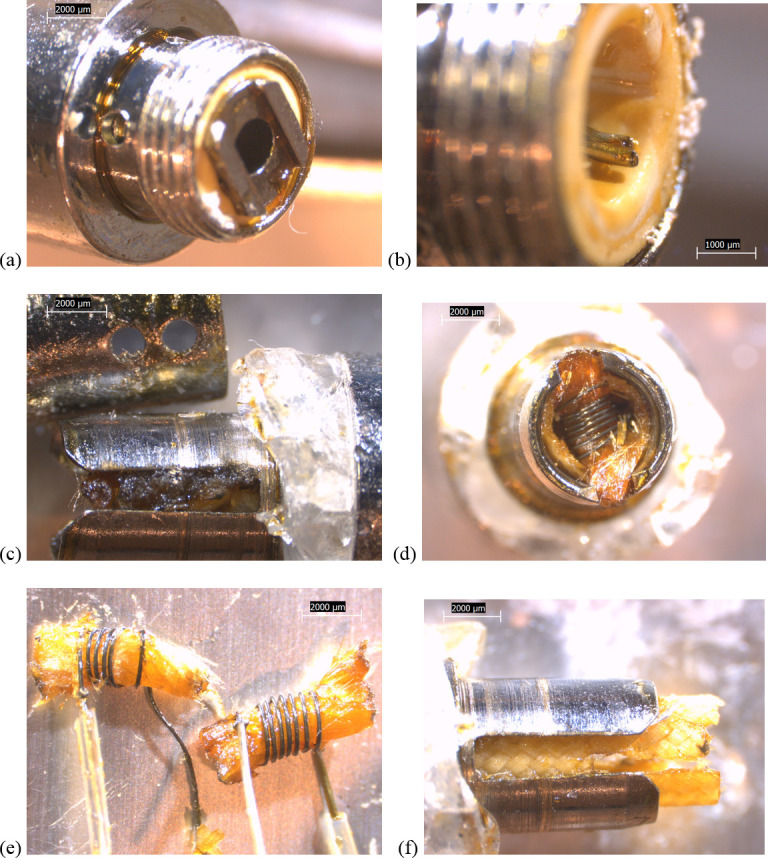 10x stereozoom microscope images of components from new THC cartridge “unknown #2”.a) battery contact with rectangular rails, inside white polymer gasket. b) wire leads visible with battery contact removed. c) side view of air tube with two wick access holes, and filament housing slot showing two stacked filaments obscured by wick material, insulation, and oil residues. Broken tank glass is also visible. d) bottom view of bottom-most filament and wick. e) both filaments with wicks and one polymer sheath each. f) quilted fibrous insulation with slot cut out to expose filaments to oil.