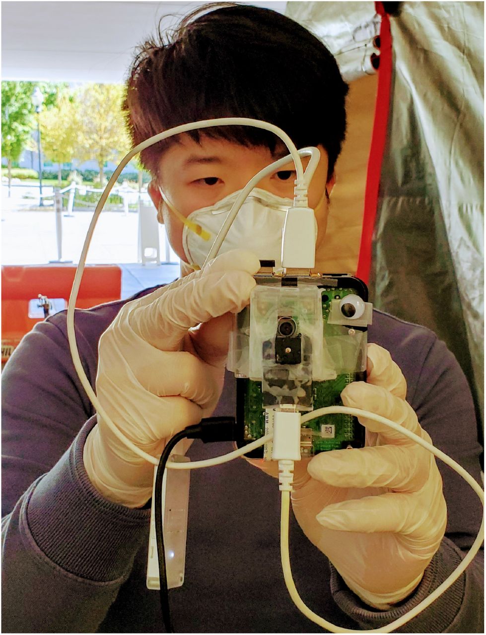 Photo of one of the authors testing out the system at the emergency department during a preliminary field trial.